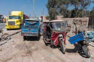 Different types of vehicles at Yauca village Peru