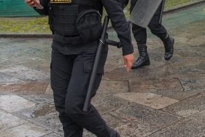 Police patrolling in connection with a political demonstration in Lima Peru