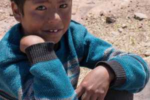 Indigenous Peruvian young boy on the Island of Taquile in Lake Titicaca Peru